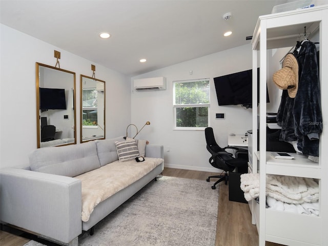 2261 NW 24th Ave, Gainesville, FL 32605 - home office featuring a wall mounted AC, wood finished floors, recessed lighting, and vaulted ceiling