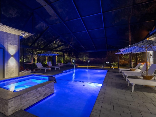 2261 NW 24th Ave, Gainesville, FL 32605 - pool at twilight with a patio area and a pool with connected hot tub