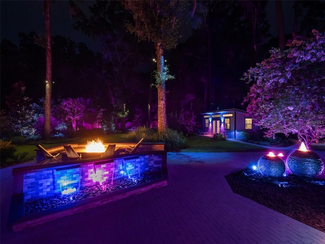 2261 NW 24th Ave, Gainesville, FL 32605 - pool at twilight featuring a fire pit