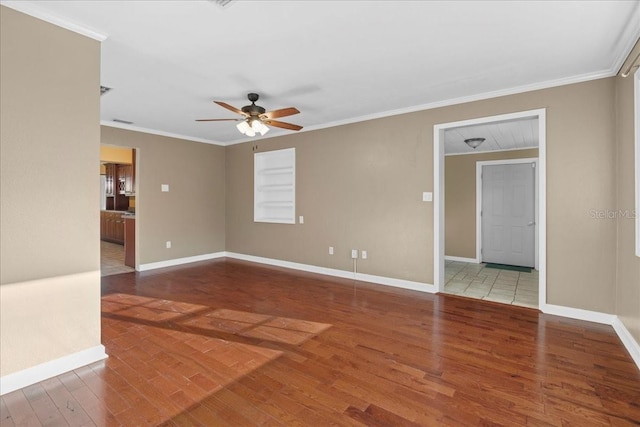 3404 NW 4th St, Gainesville, FL 32609 - spare room featuring wood finished floors, a ceiling fan, and crown molding