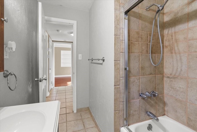3404 NW 4th St, Gainesville, FL 32609 - full bath featuring washtub / shower combination, tile patterned floors, and vanity