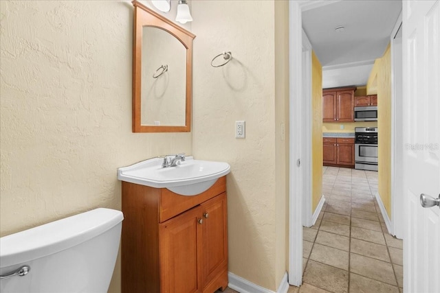 3404 NW 4th St, Gainesville, FL 32609 - bathroom featuring vanity, a textured wall, and tile patterned flooring