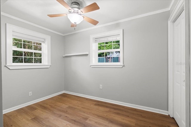 3404 NW 4th St, Gainesville, FL 32609 - unfurnished bedroom with ornamental molding, wood finished floors, and ceiling fan