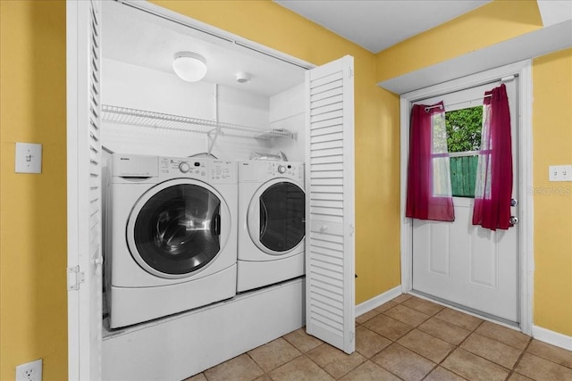 3404 NW 4th St, Gainesville, FL 32609 - washroom with washer and dryer and light tile patterned floors