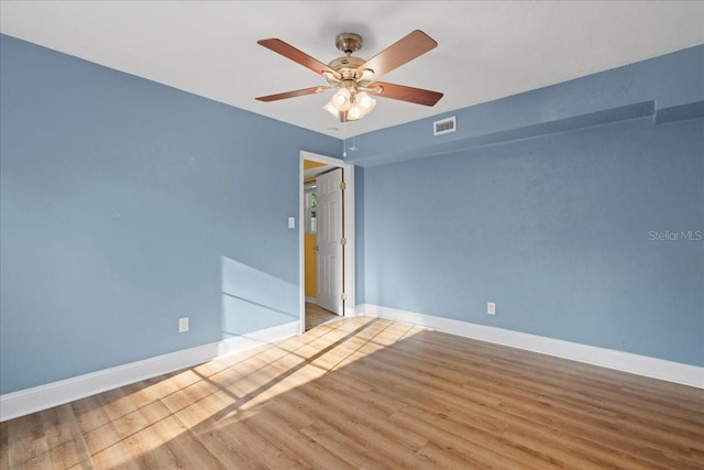 3404 NW 4th St, Gainesville, FL 32609 - empty room with wood finished floors and ceiling fan