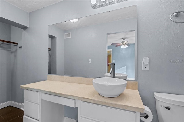 3404 NW 4th St, Gainesville, FL 32609 - bathroom featuring vanity, ceiling fan, and wood finished floors