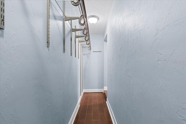 3404 NW 4th St, Gainesville, FL 32609 - hallway with dark wood-style flooring and baseboards