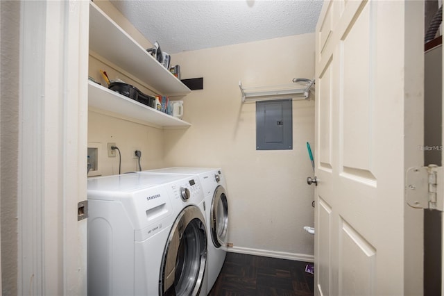 3705 SW 27th St Unit 525, Gainesville, FL 32608 - laundry room featuring electric panel, washing machine and clothes dryer, and a textured ceiling