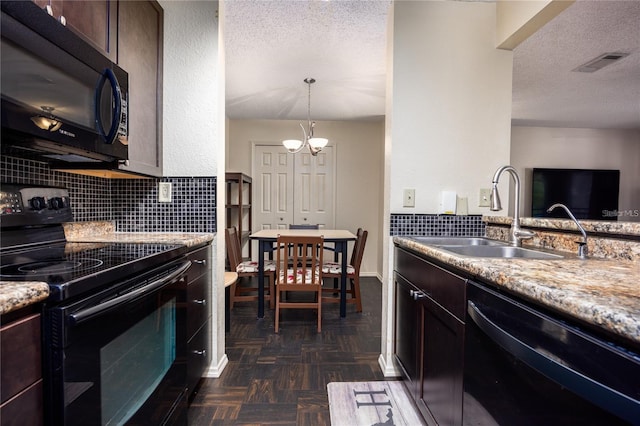3705 SW 27th St Unit 525, Gainesville, FL 32608 - kitchen with black appliances, decorative backsplash, a chandelier, a textured ceiling, and dark brown cabinetry