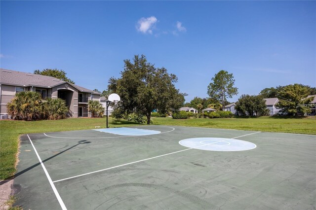 3705 SW 27th St Unit 525, Gainesville, FL 32608 - view of basketball court featuring community basketball court, a yard, and a residential view