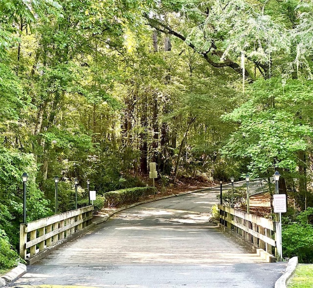 1810 NW 23rd Blvd Unit 272, Gainesville, FL 32605 - view of community featuring a wooded view