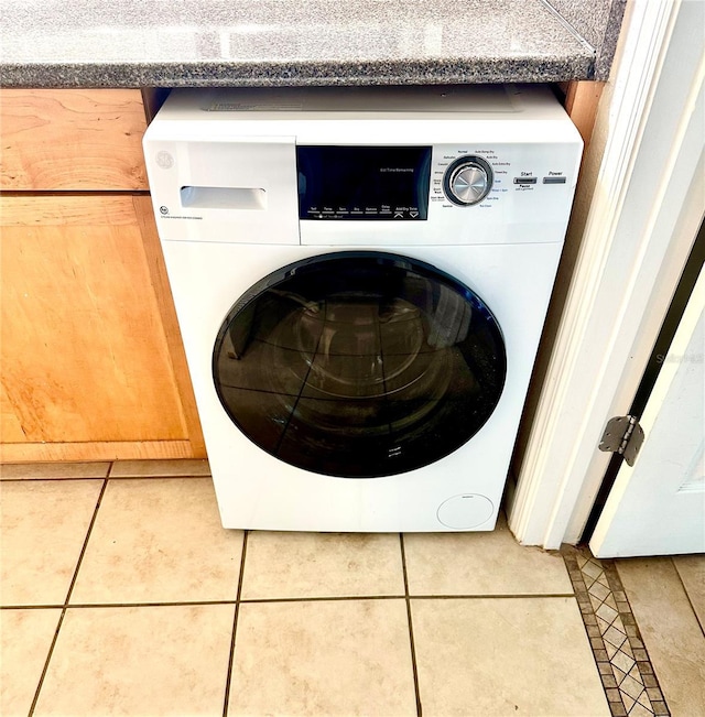 1810 NW 23rd Blvd Unit 272, Gainesville, FL 32605 - washroom featuring washer / dryer and tile patterned flooring