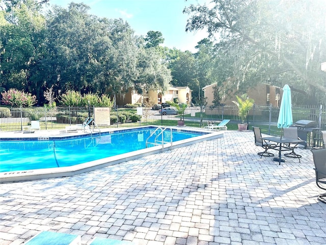 1810 NW 23rd Blvd Unit 272, Gainesville, FL 32605 - community pool featuring a patio area