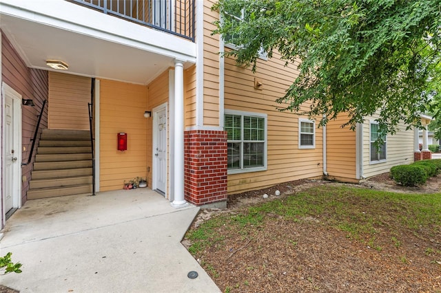 1573 NW 29th Rd Unit 3, Gainesville, FL 32605 - property entrance with brick siding and a balcony
