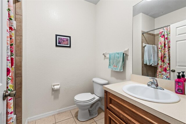 1573 NW 29th Rd Unit 3, Gainesville, FL 32605 - bathroom featuring vanity, tile patterned flooring, and curtained shower