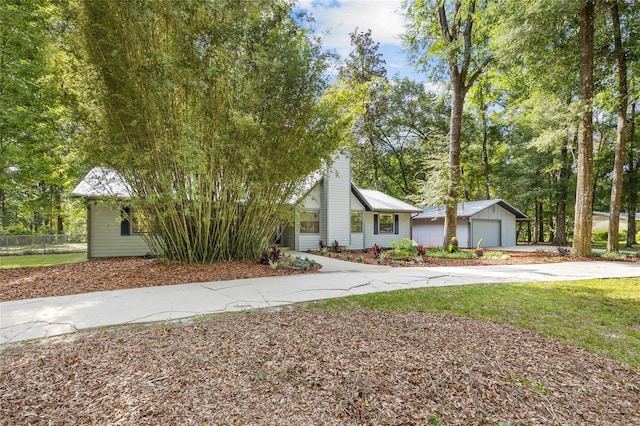 2101 SW 79th Dr, Gainesville, FL 32607 - view of front facade featuring concrete driveway and an outbuilding