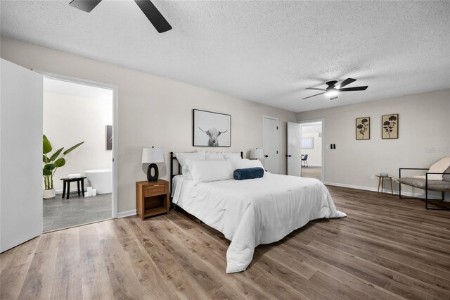 2101 SW 79th Dr, Gainesville, FL 32607 - bedroom with a textured ceiling, wood finished floors, and a ceiling fan