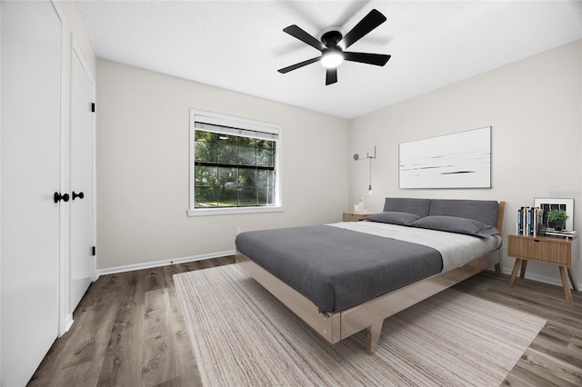 2101 SW 79th Dr, Gainesville, FL 32607 - bedroom featuring wood finished floors and ceiling fan