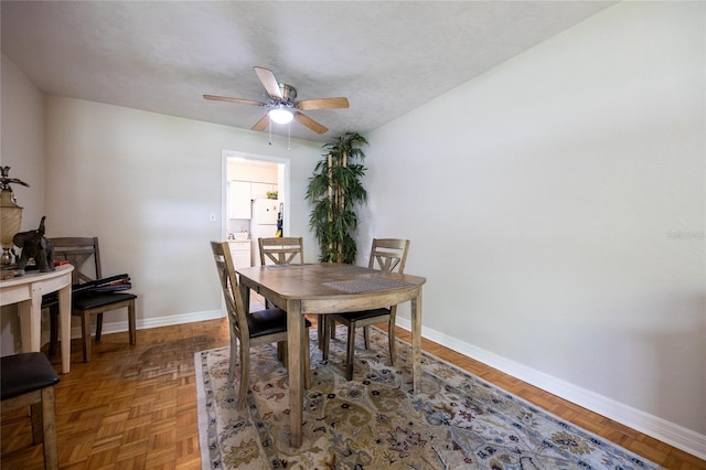5022 NW 34th Ter, Gainesville, FL 32605 - dining area featuring baseboards and ceiling fan