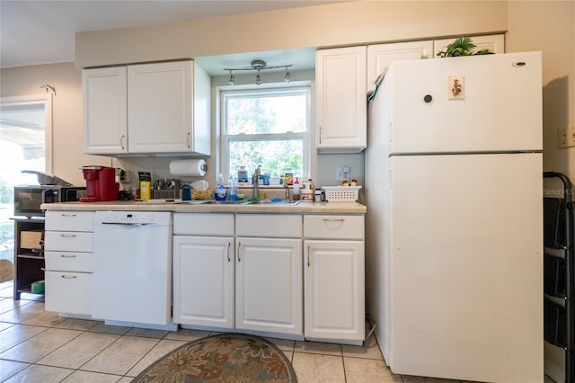 5022 NW 34th Ter, Gainesville, FL 32605 - kitchen featuring white appliances, light tile patterned flooring, white cabinets, and light countertops