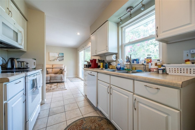 5022 NW 34th Ter, Gainesville, FL 32605 - kitchen with white appliances, white cabinetry, light countertops, recessed lighting, and light tile patterned floors