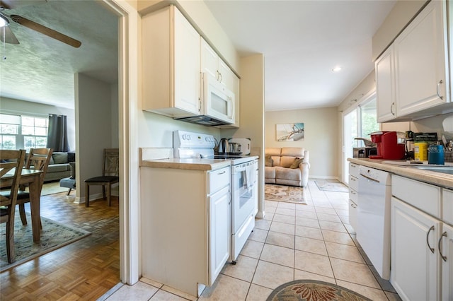 5022 NW 34th Ter, Gainesville, FL 32605 - kitchen with white appliances, plenty of natural light, a ceiling fan, light countertops, and recessed lighting