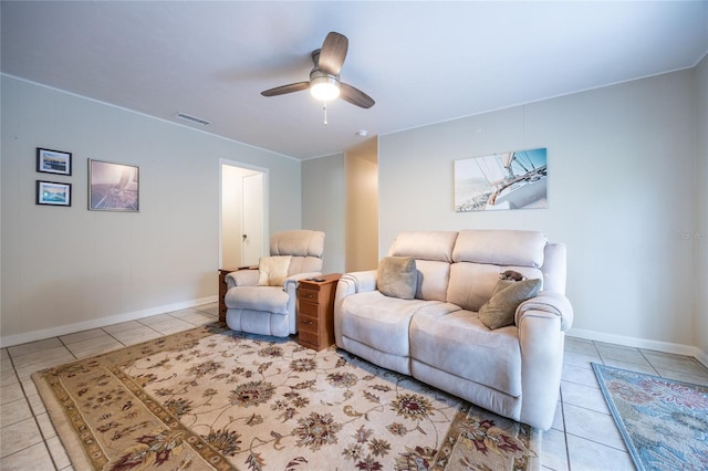 5022 NW 34th Ter, Gainesville, FL 32605 - tiled living room featuring baseboards and ceiling fan
