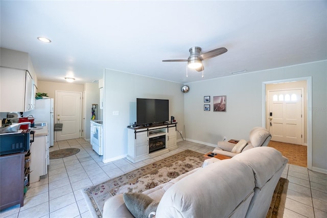 5022 NW 34th Ter, Gainesville, FL 32605 - living room with light tile patterned floors, ceiling fan, and recessed lighting