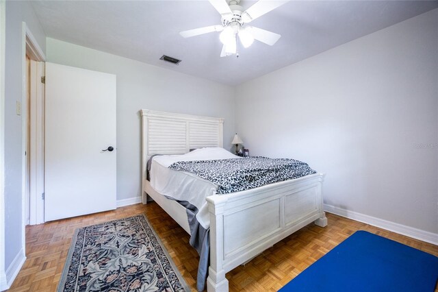 5022 NW 34th Ter, Gainesville, FL 32605 - bedroom with baseboards and ceiling fan