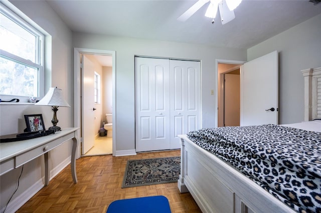 5022 NW 34th Ter, Gainesville, FL 32605 - bedroom featuring a closet, a ceiling fan, and ensuite bathroom