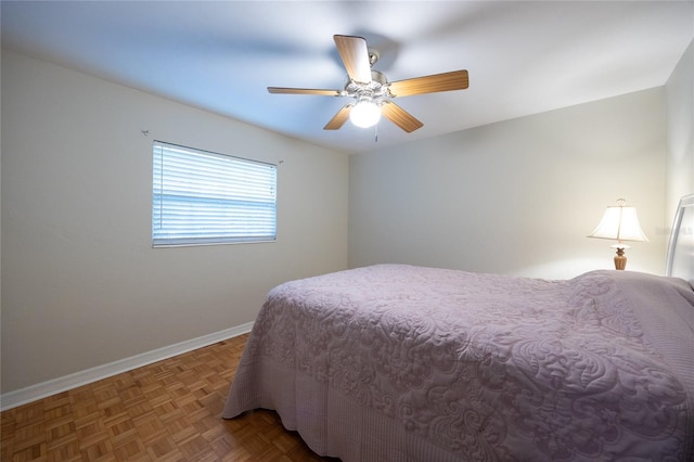 5022 NW 34th Ter, Gainesville, FL 32605 - bedroom with baseboards and ceiling fan