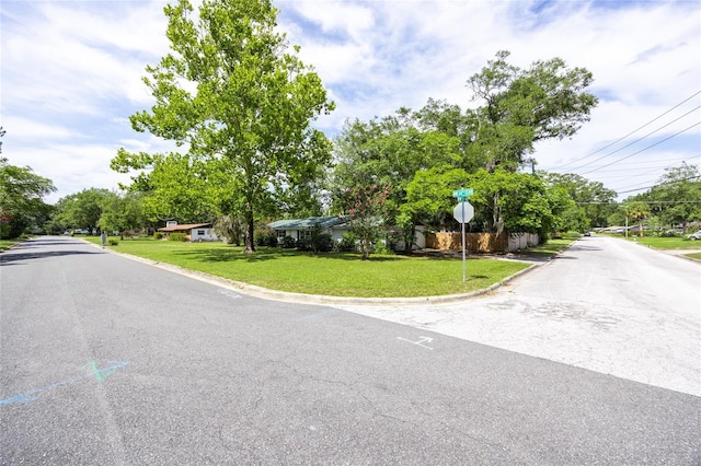 5022 NW 34th Ter, Gainesville, FL 32605 - view of asphalt road featuring curbs and traffic signs