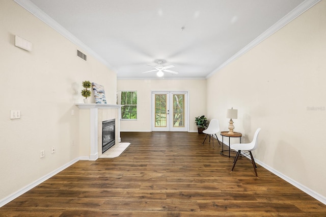 5133 SW 91st Ct Unit G202, Gainesville, FL 32608 - living area featuring ornamental molding, ceiling fan, a fireplace, and dark wood-type flooring