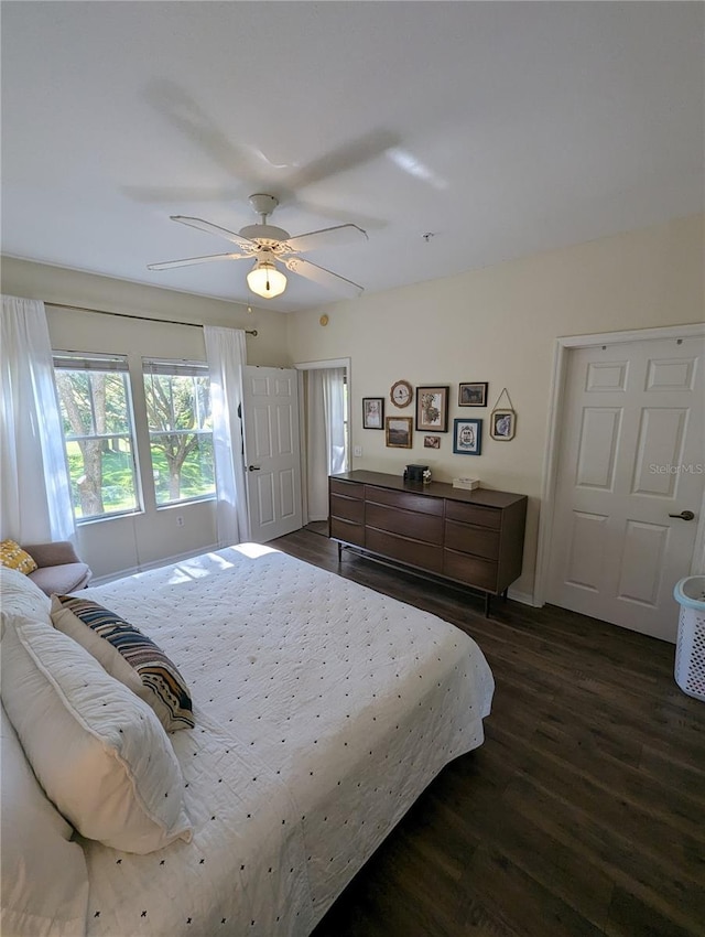 5133 SW 91st Ct Unit G202, Gainesville, FL 32608 - bedroom featuring dark wood-style flooring and ceiling fan