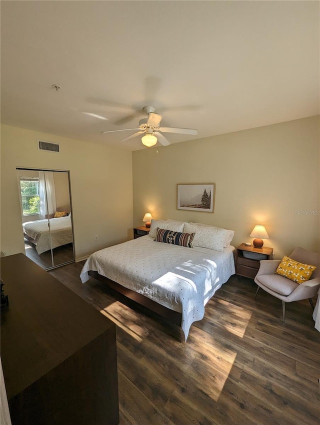 5133 SW 91st Ct Unit G202, Gainesville, FL 32608 - bedroom featuring dark wood-style floors, a ceiling fan, and a closet