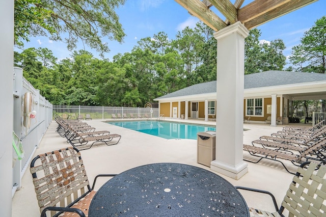 5133 SW 91st Ct Unit G202, Gainesville, FL 32608 - community pool featuring a patio and view of wooded area