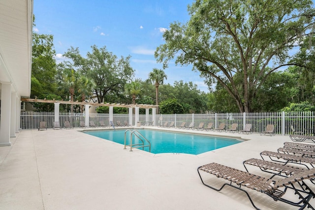 5133 SW 91st Ct Unit G202, Gainesville, FL 32608 - community pool with a patio and view of scattered trees