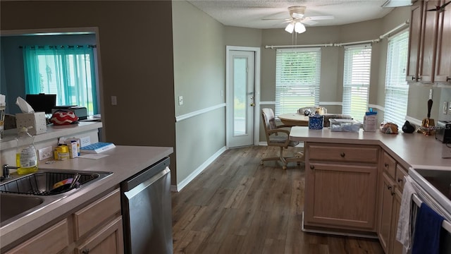 32932 Crooked Oaks Ln, Leesburg, FL 34748 - kitchen with stainless steel dishwasher, ceiling fan, dark wood-type flooring, light countertops, and white range with electric cooktop