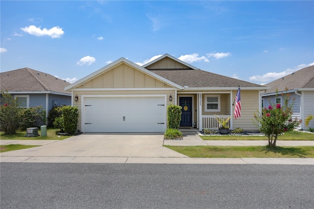 25111 SW 6th Ln, Newberry, FL 32669 - single story home with driveway, board and batten siding, a garage, a porch, and a shingled roof