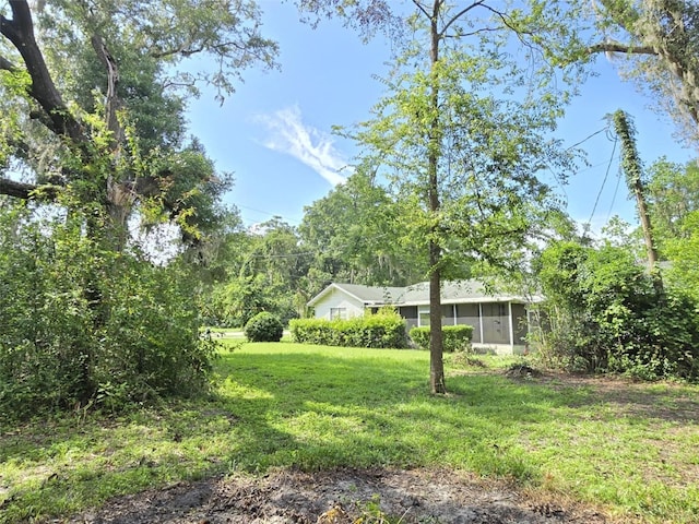 18248 High Springs Main St, High Springs, FL 32643 - view of grassy yard featuring a sunroom