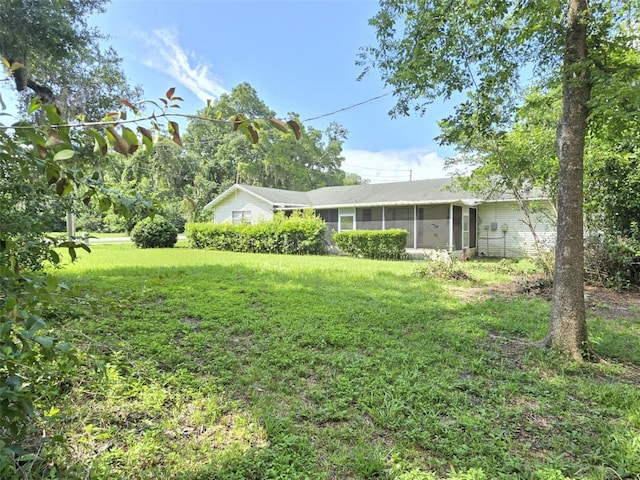 18248 High Springs Main St, High Springs, FL 32643 - view of front of house featuring a sunroom and a front yard