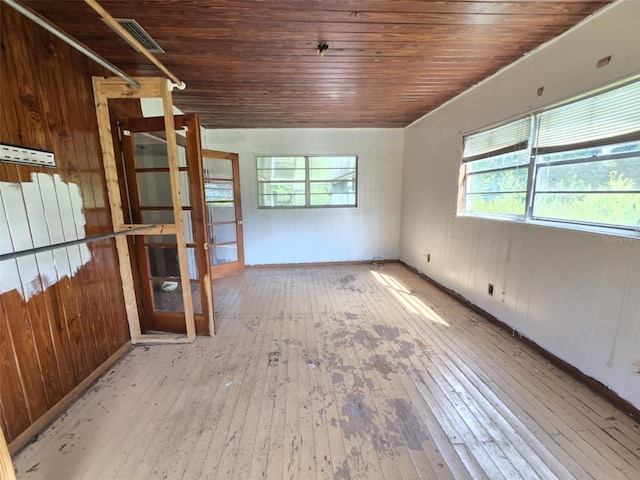 18248 High Springs Main St, High Springs, FL 32643 - unfurnished room featuring hardwood / wood-style floors, healthy amount of natural light, wood ceiling, and wood walls