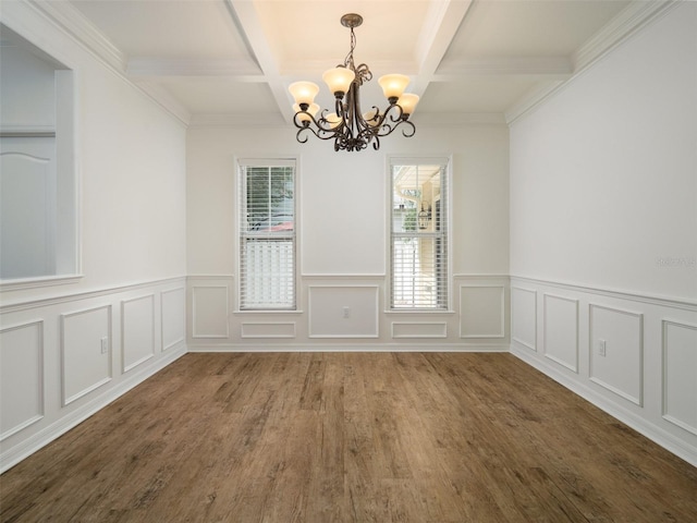 441 SW 129th Ter, Newberry, FL 32669 - unfurnished dining area featuring coffered ceiling, a chandelier, beam ceiling, wood finished floors, and a wainscoted wall