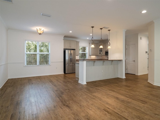 441 SW 129th Ter, Newberry, FL 32669 - kitchen featuring stainless steel appliances, dark wood-type flooring, open floor plan, healthy amount of natural light, and crown molding