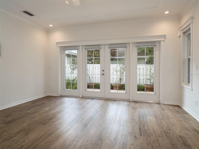 441 SW 129th Ter, Newberry, FL 32669 - empty room featuring wood finished floors, ornamental molding, and recessed lighting