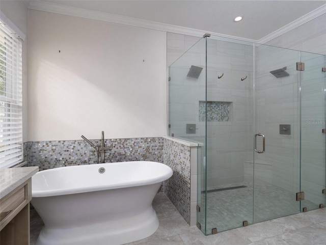 441 SW 129th Ter, Newberry, FL 32669 - bathroom featuring ornamental molding, tile walls, a soaking tub, a stall shower, and vanity