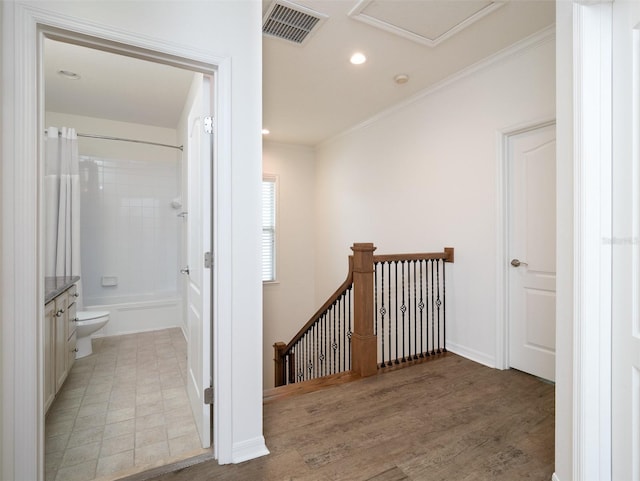 441 SW 129th Ter, Newberry, FL 32669 - corridor featuring an upstairs landing, ornamental molding, light wood-style flooring, recessed lighting, and attic access