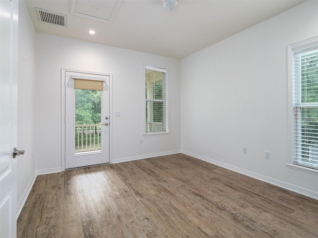 441 SW 129th Ter, Newberry, FL 32669 - spare room featuring wood finished floors and recessed lighting