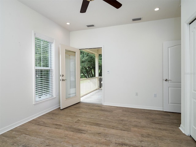 441 SW 129th Ter, Newberry, FL 32669 - unfurnished room featuring a ceiling fan, wood finished floors, recessed lighting, and french doors