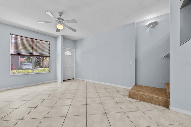 4415 SW 34th St Unit 107, Gainesville, FL 32608 - tiled spare room with a ceiling fan and baseboards